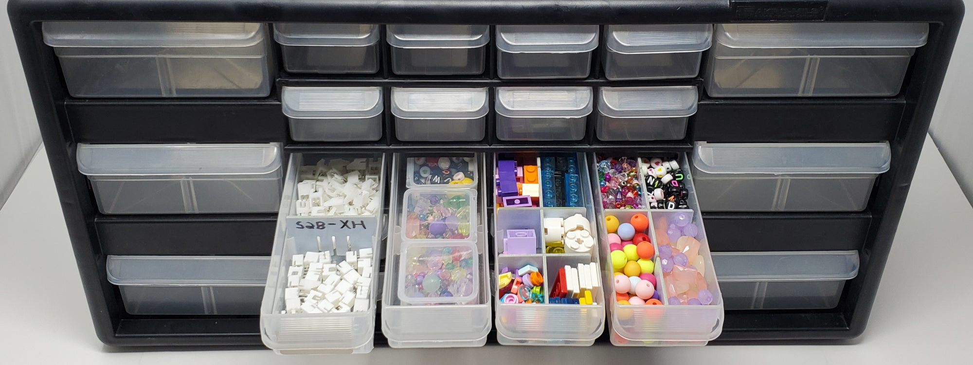 Bin Better - Configurable bin dividers and bin divider boxes in an Akro-Mils storage cabinet