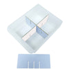 Transparent square tray with four smaller square compartments on a white background